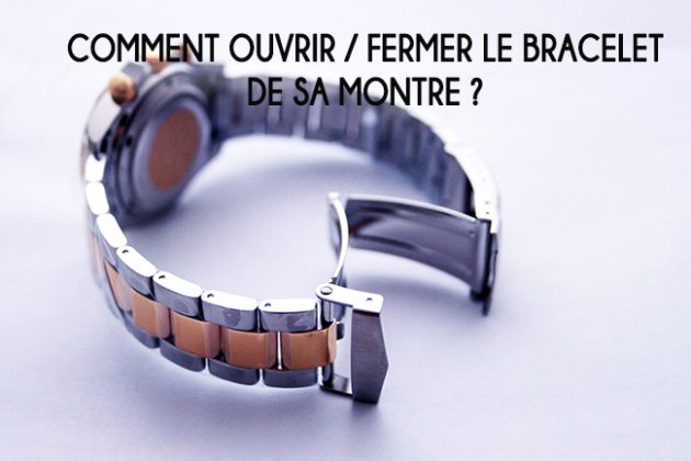 Gros plan sur un bracelet de montre bicolore en métal avec sa boucle déployante ouverte