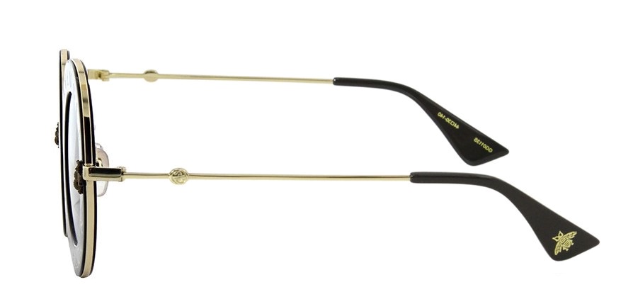 Lunettes de soleil dorées et noires, vue latérale, branches ornées du logo abeille